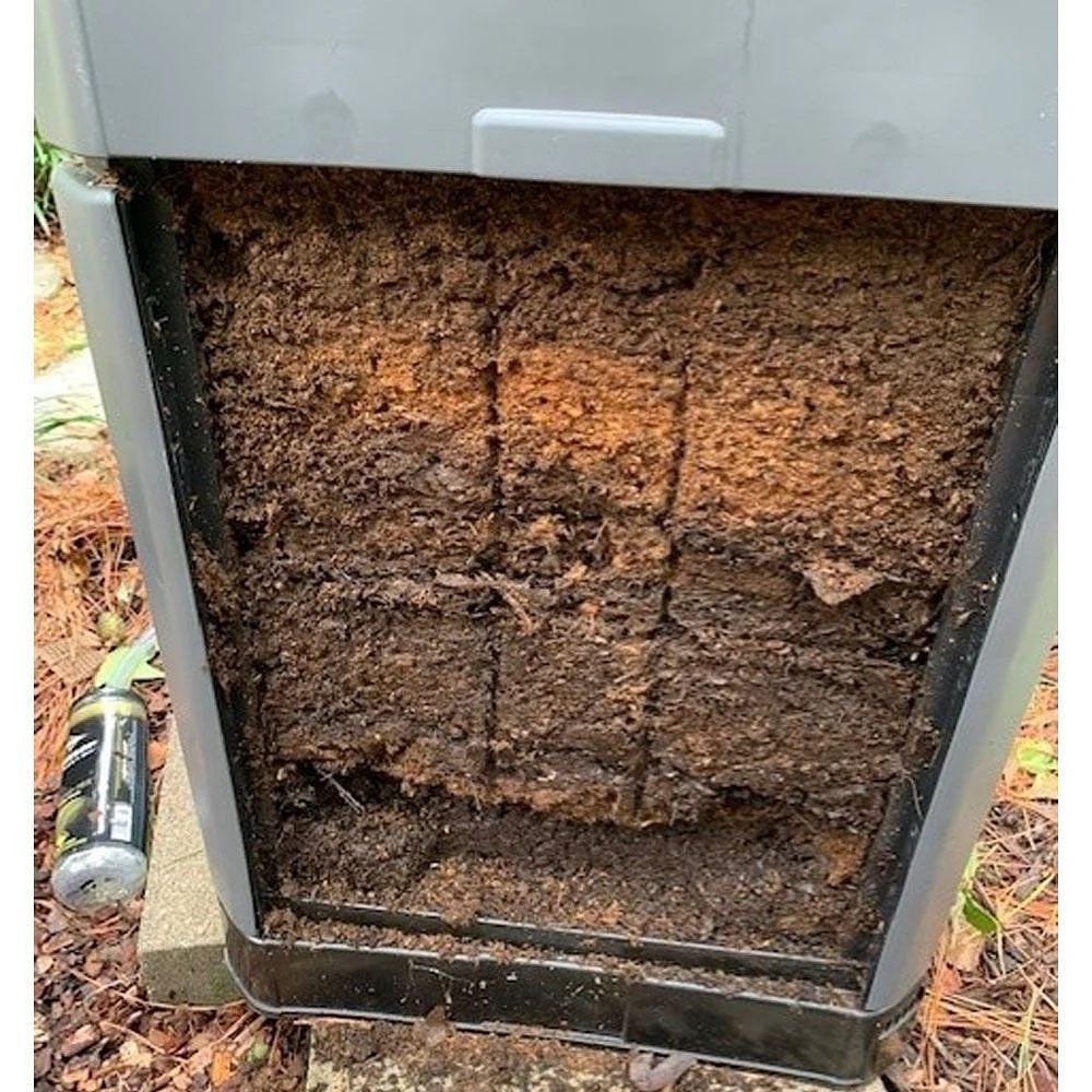Inside of a hot grey compost bin showing compost